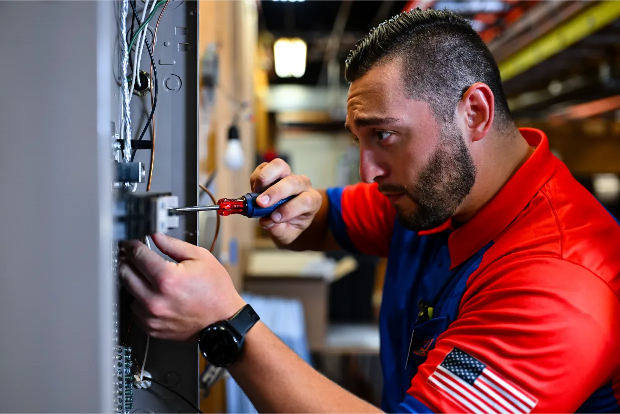 Electrician working on an electrical panel